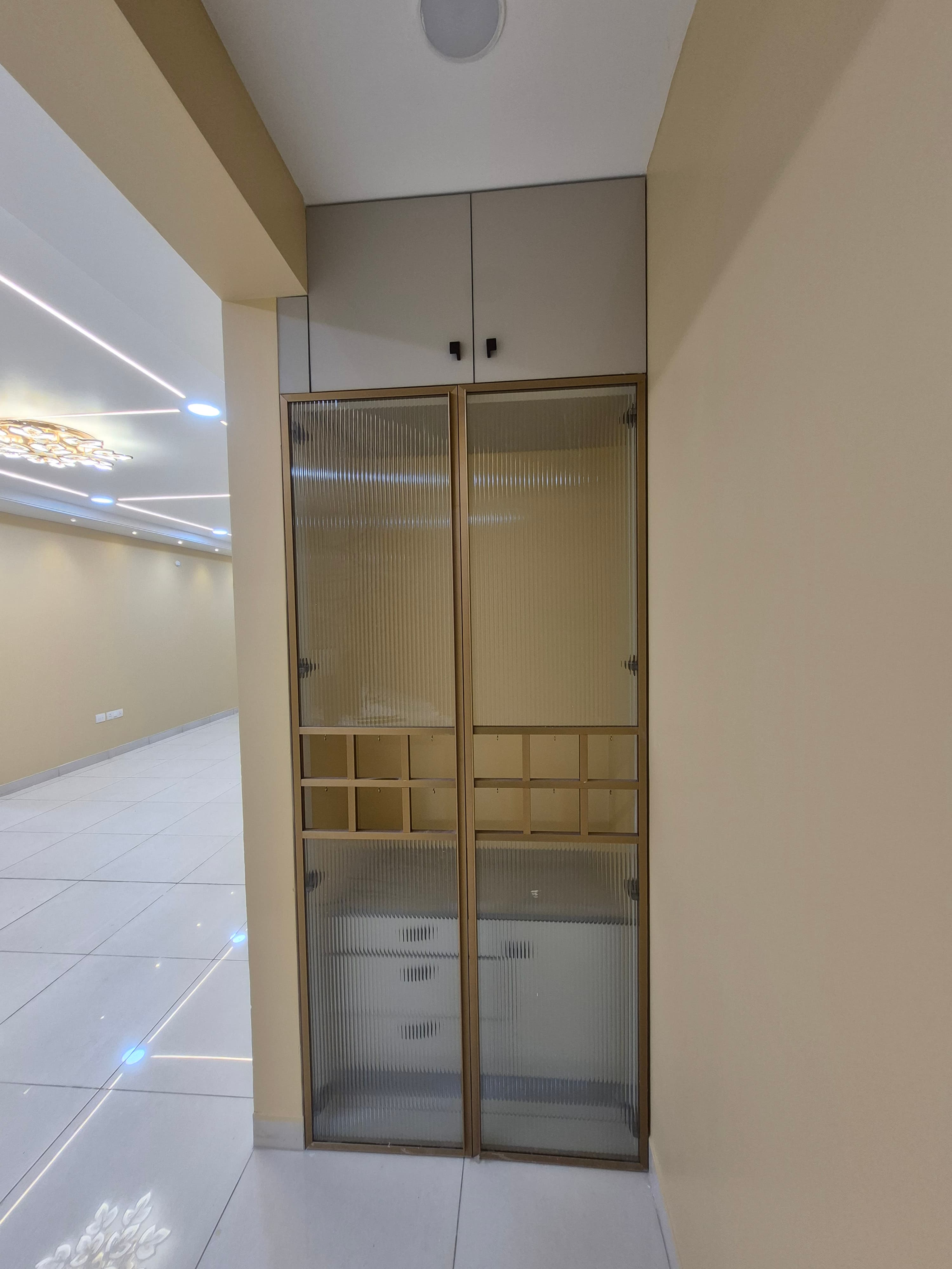 Fluted glass crockery unit at Amaravati Premium Apartment